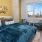 a bedroom with a bed and a chair