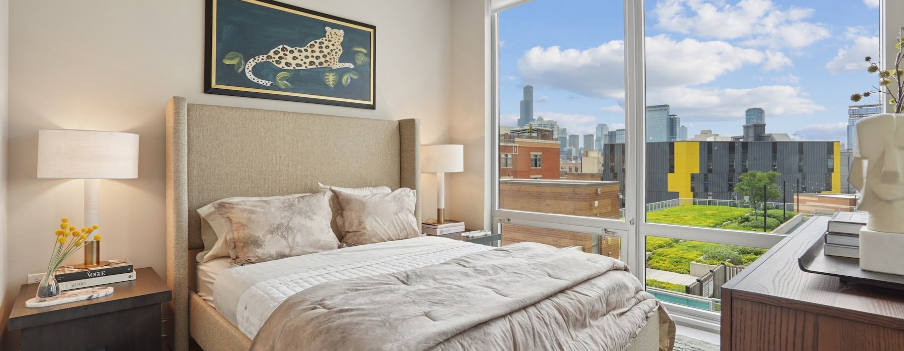 a bedroom with a bed and two nightstands