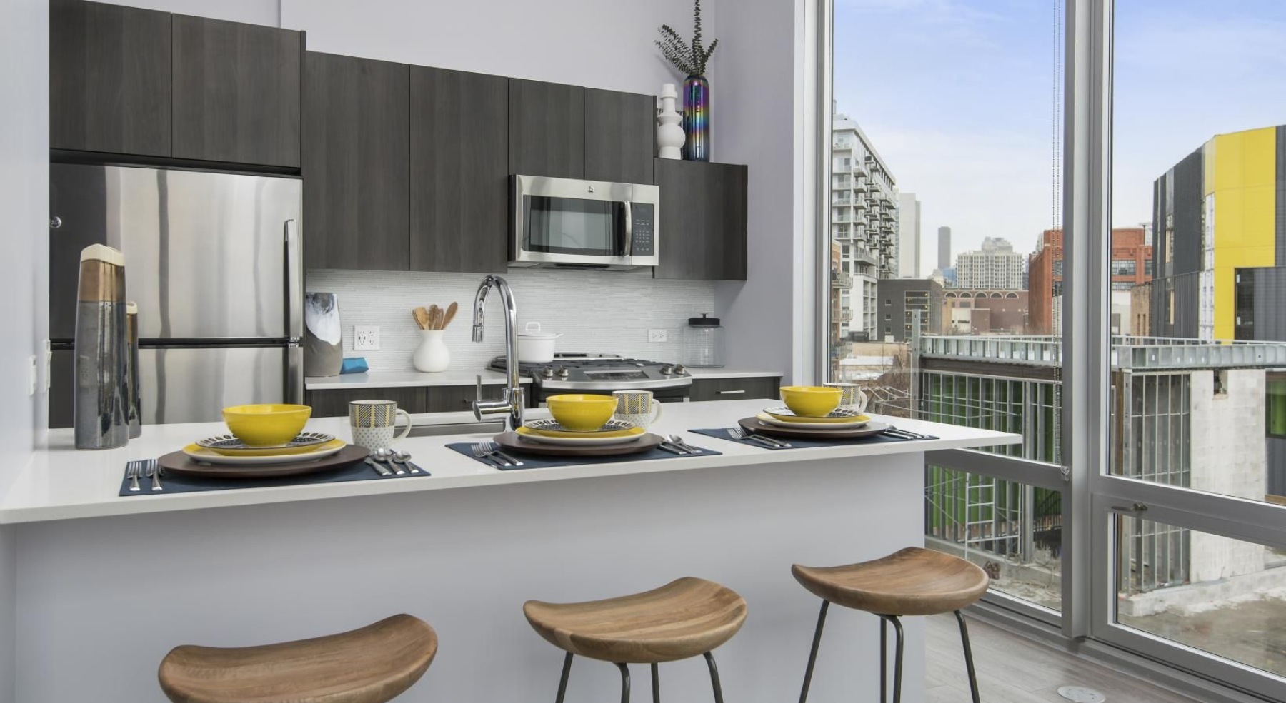 a kitchen with a table and chairs