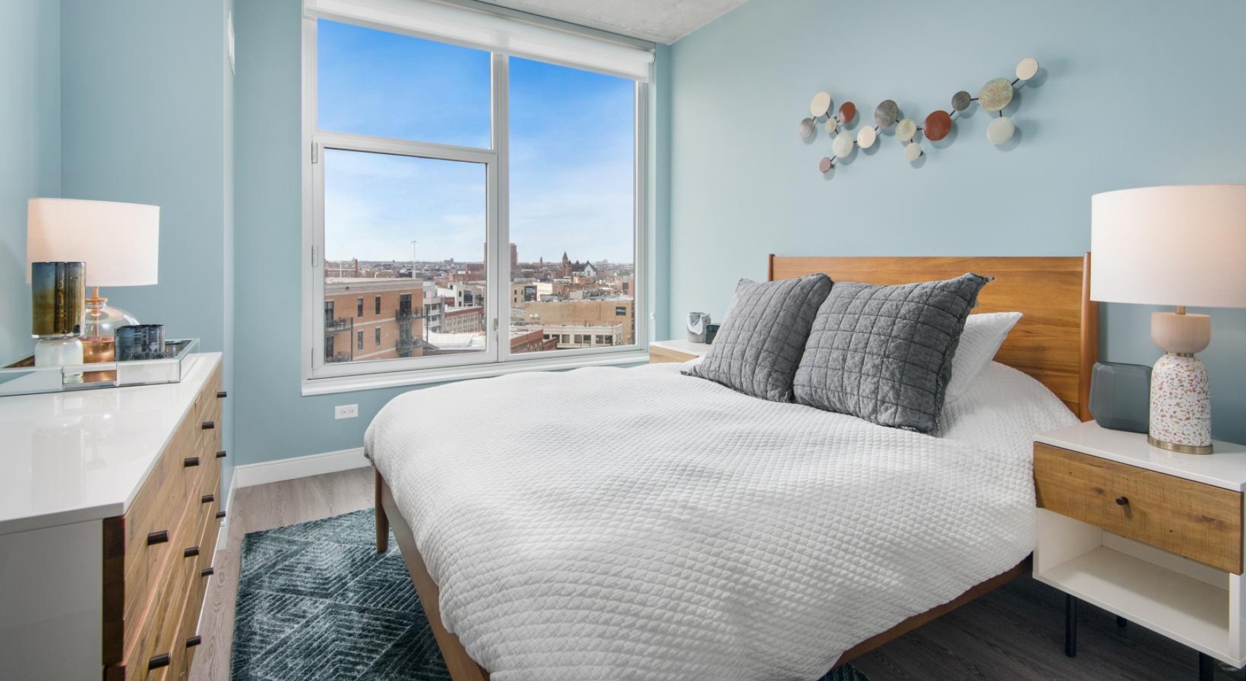 a bedroom with a large window