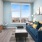 a living room with a blue couch